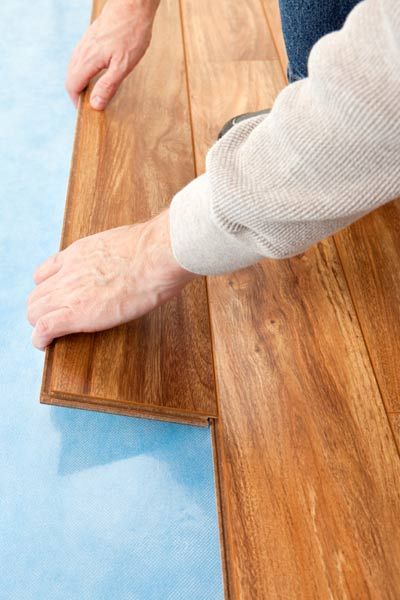 Standard thickness refinished wood floors being installed.