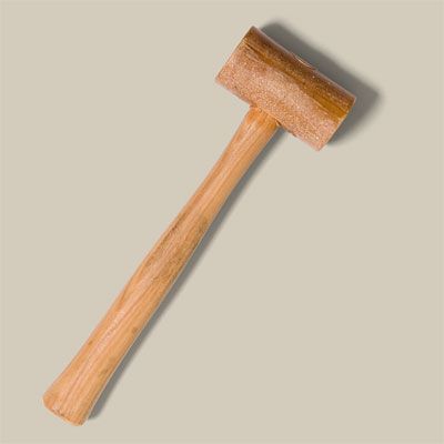 A rawhide mallet for tin punching.