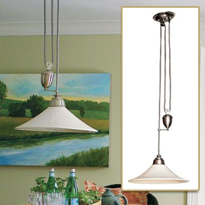 Image of an adjustable pendant light used to add functionality and style to a rustic French dining room