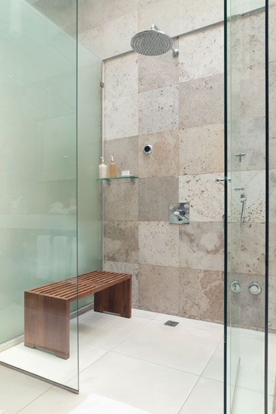 Image of a bench in a shower, which provides a nice place to rest and store toiletries