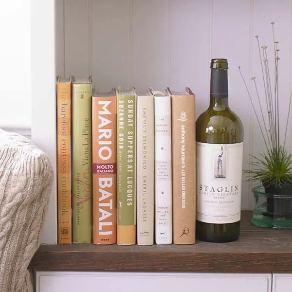 Propping books with a wine bottle