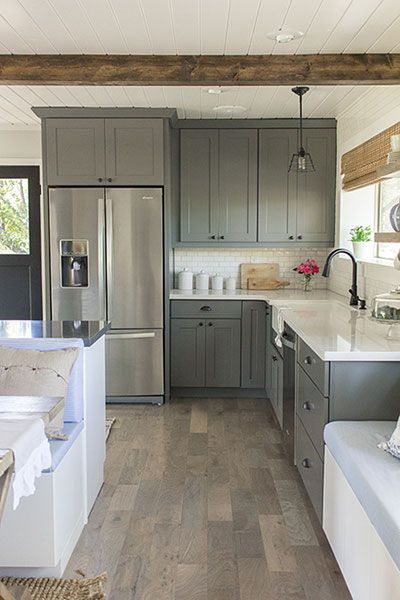 Faux wood beams in a rustic kitchen ceiling on a budget.