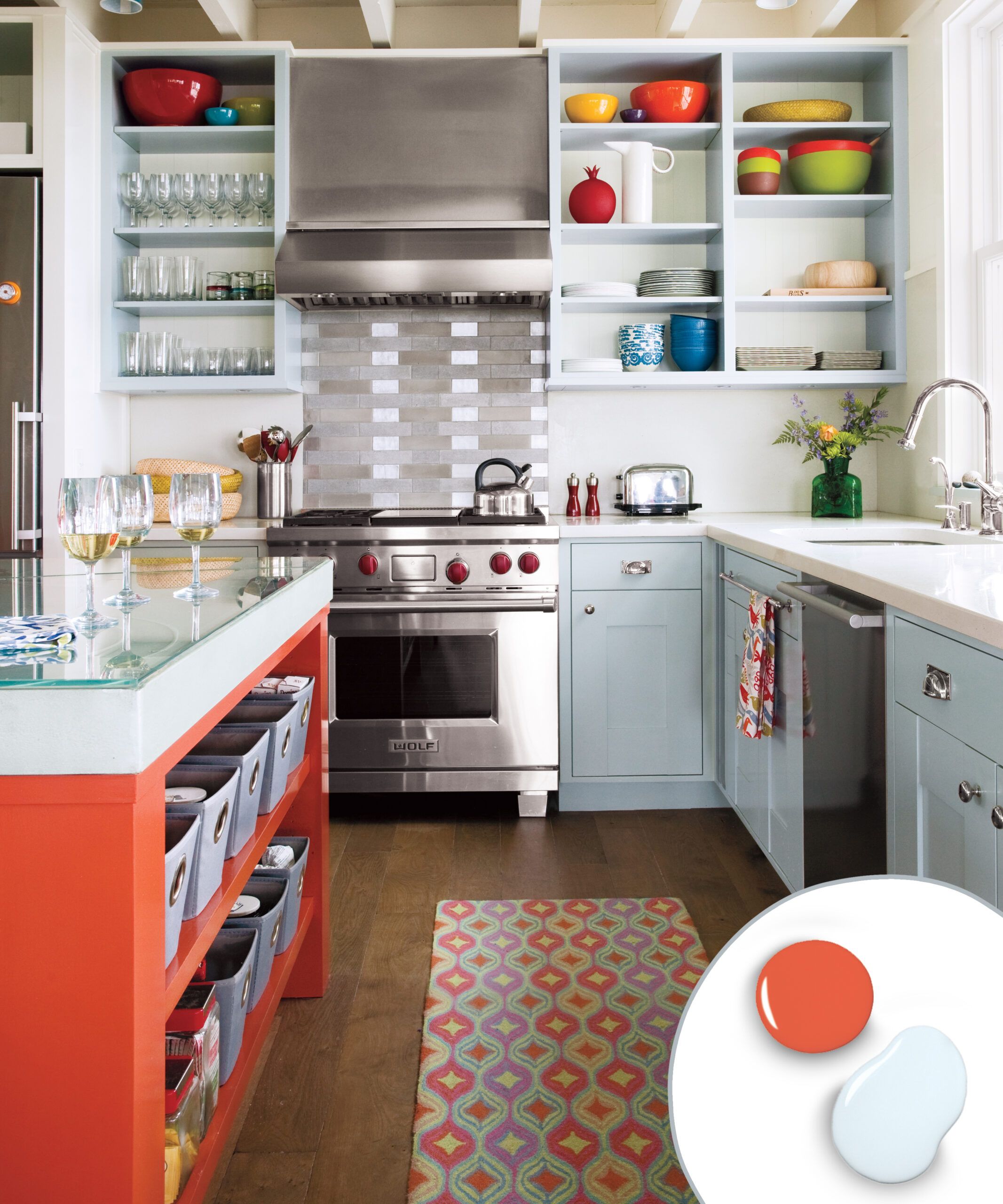 Kitchen cabinets with a cool grey and hot orange color combination.