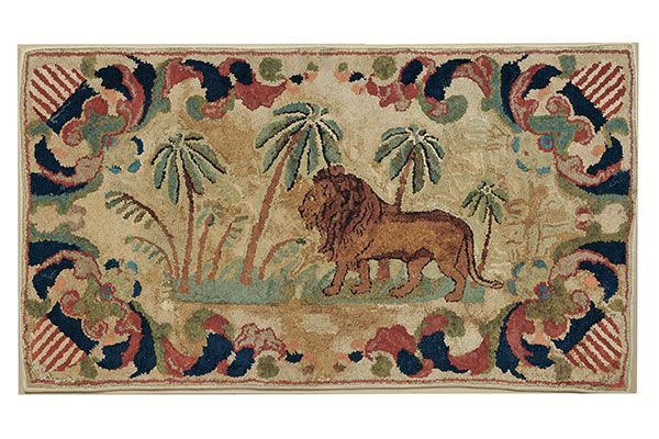 A designer rug called "Frost Pattern" depicting a scene with a lion and palm trees.