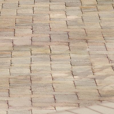 A patio made of brick and concrete pavers.