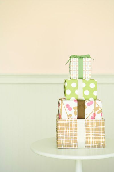 A pile of presents wrapped with wallpaper scraps.