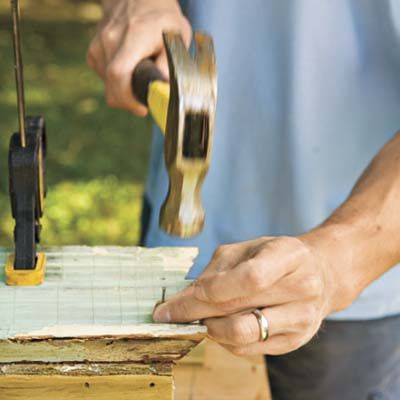 A window box is secured with nails.