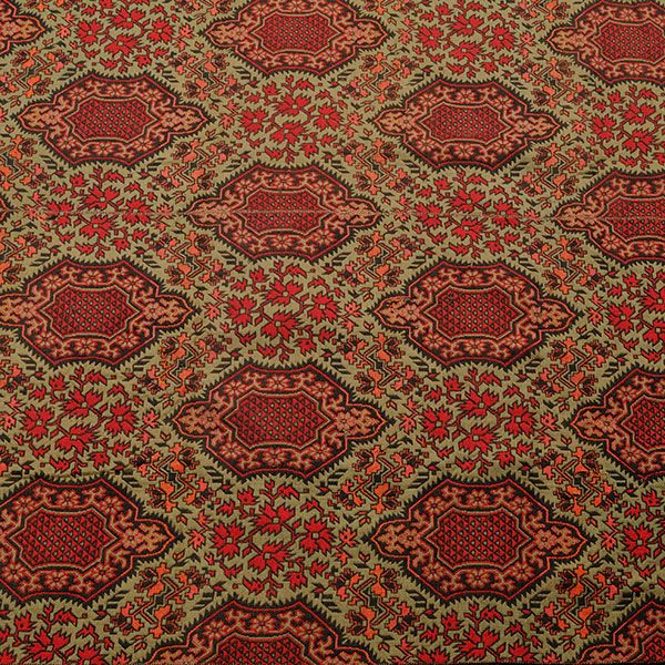 A room-size red and green Ingrain carpet.