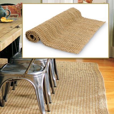 Image of a natural fiber rug used to anchor a rustic French dining room