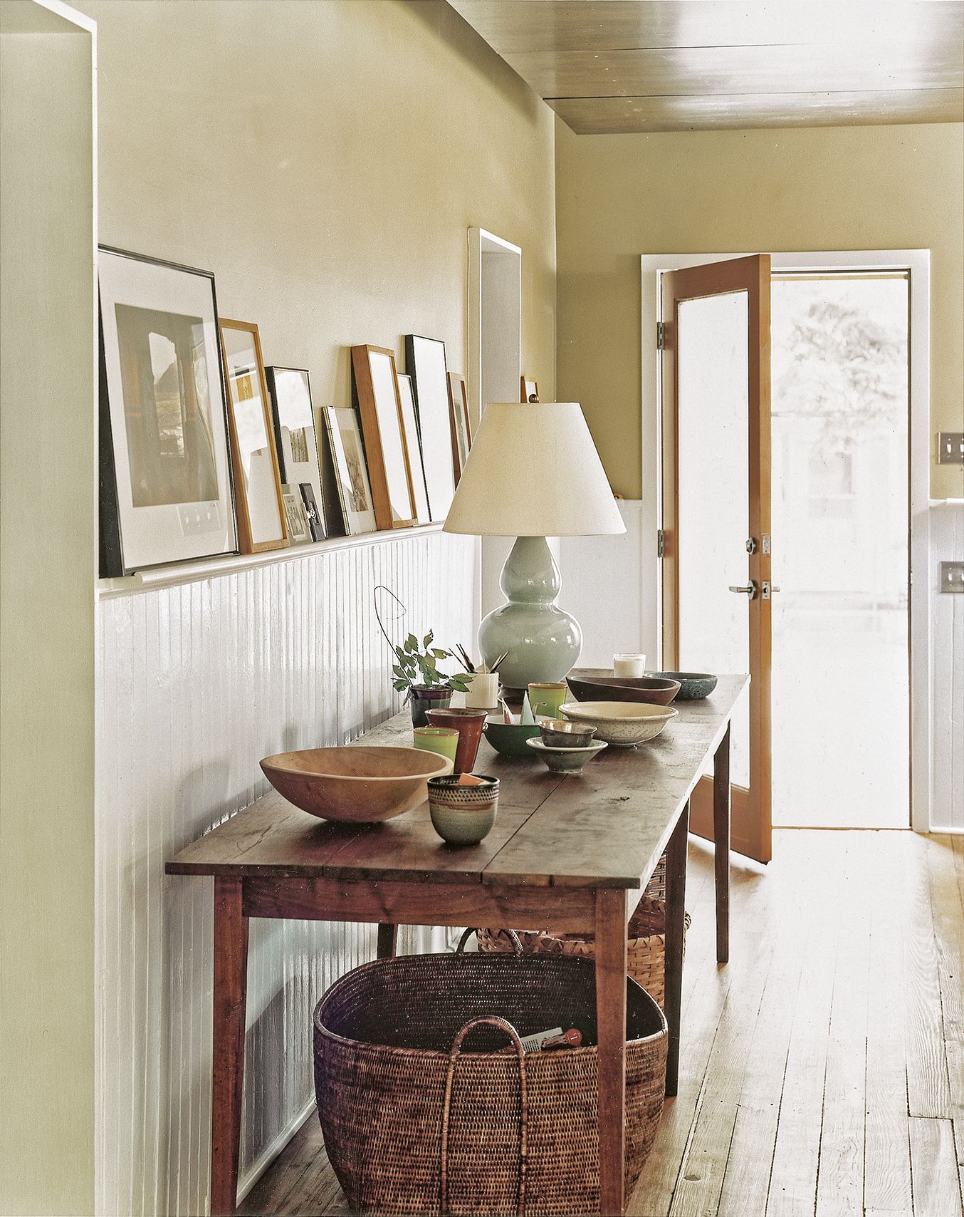 Wainscoting with a display rail give a room vintage charm.