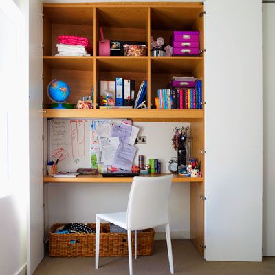 A study station that can be covered with a bifold to hide the clutter. 