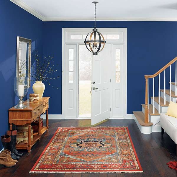 Home Foyer with navy blue walls.