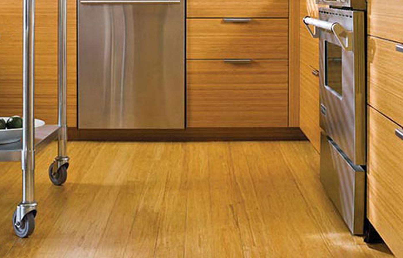 Bamboo flooring stained with a yellow hue in a kitchen.