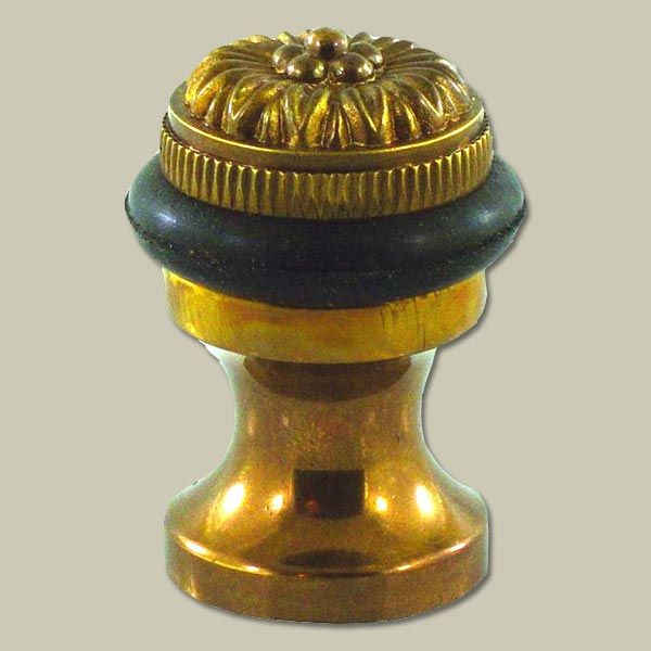 A decorative brass doorstop.