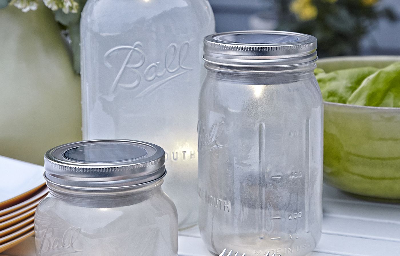 Outdoor tabletop mason jar lights.