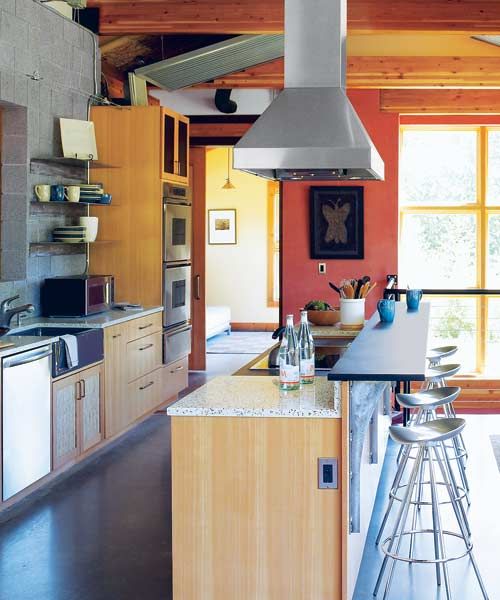 A ceiling mounted vent hood in a kitchen.