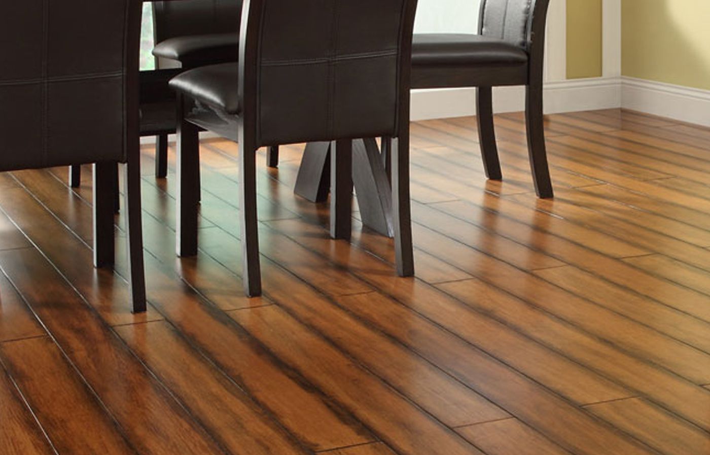 Bamboo flooring stained for the planks to be darker on the sides and lighter in the center.