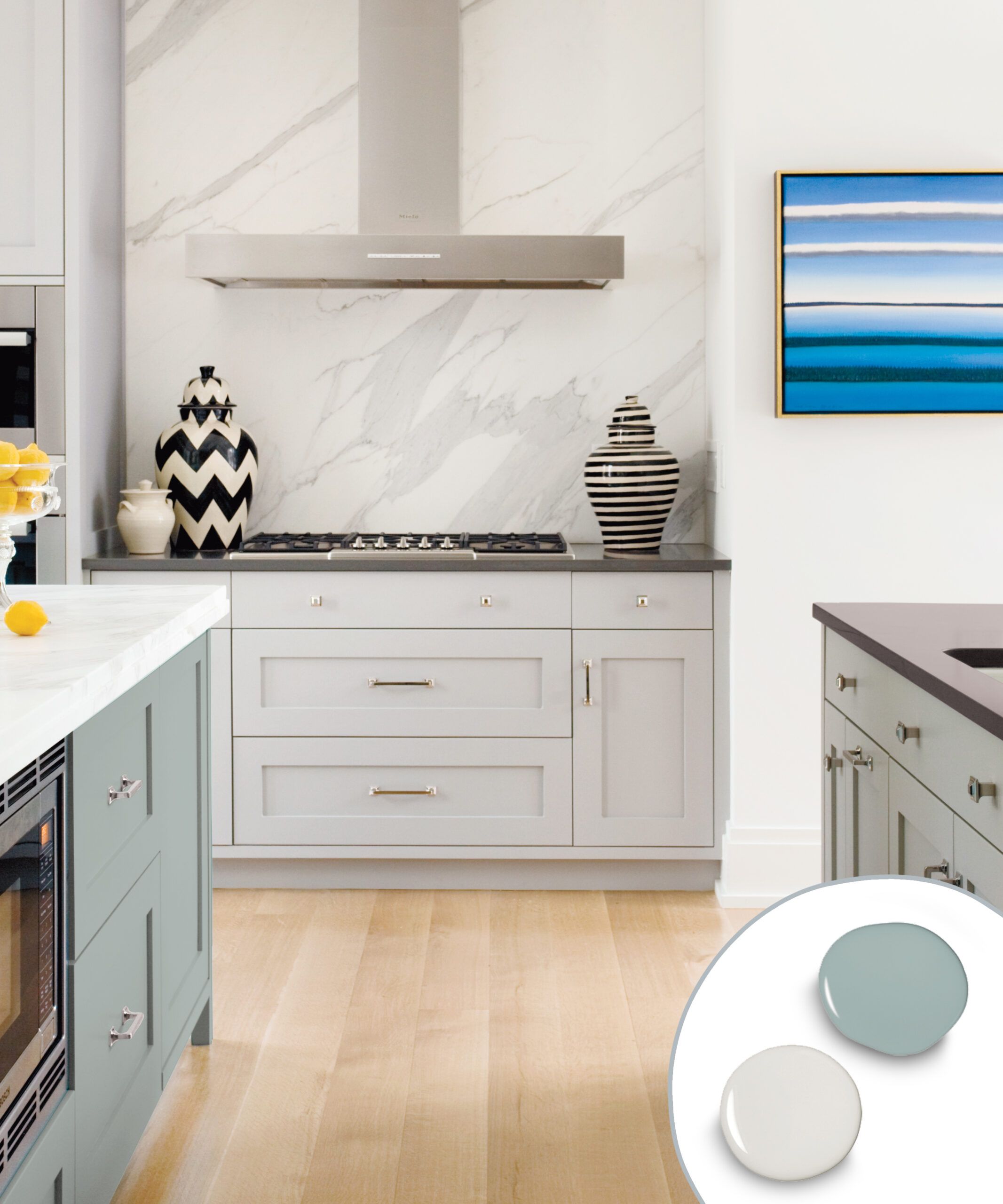 Kitchen cabinets with a pale gray and greenish blue color combination.