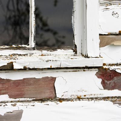 A Man Standing In Window Of Old House Photograph by Ron Koeberer