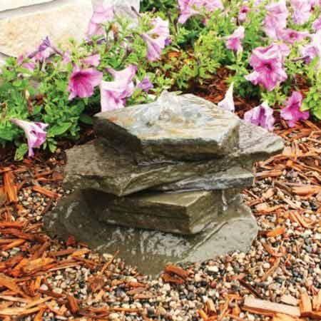 A stone water feature to decorate an entrance.