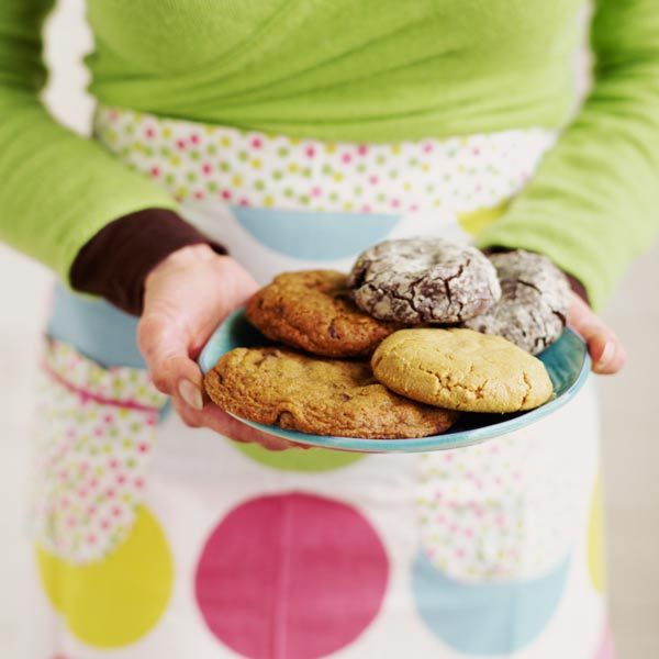 a neighbor offering a plate of cookies.