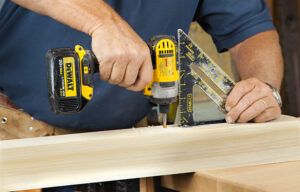 Two images of a man connecting newel posts for a spindle headboard.