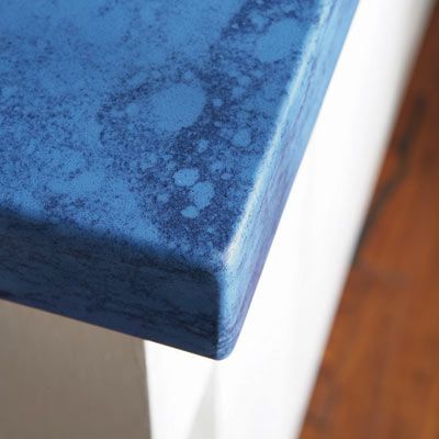 Resin-based countertop corner in a bathroom.