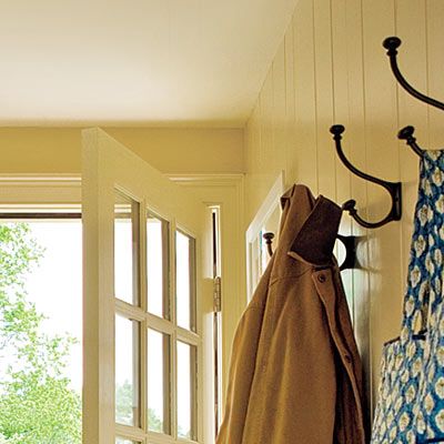 hooks to hang jackets on within a mudroom