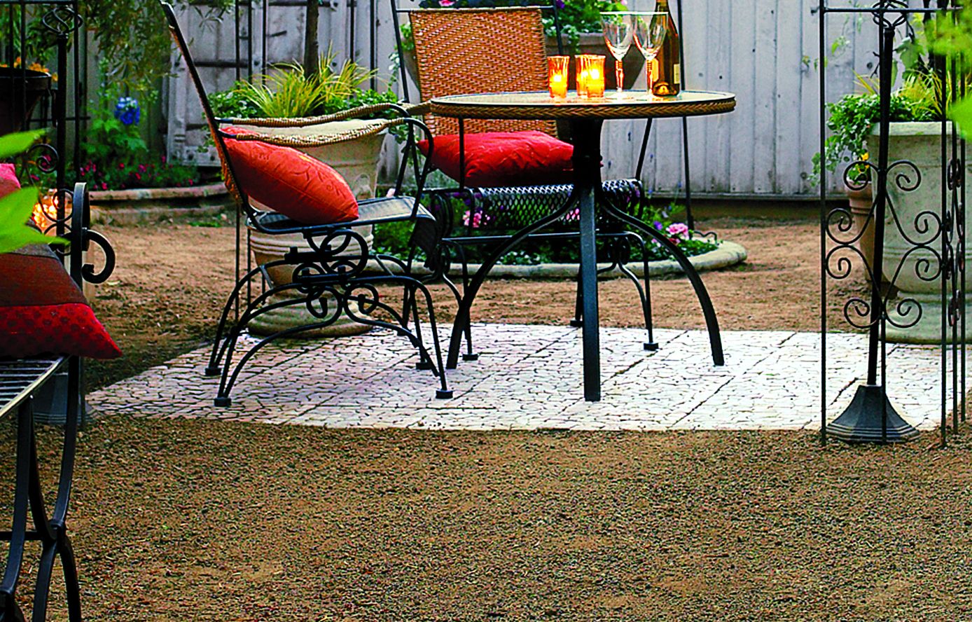 A tiled area rug for an outdoor dining space.