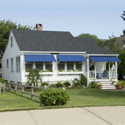 A home with window awnings.