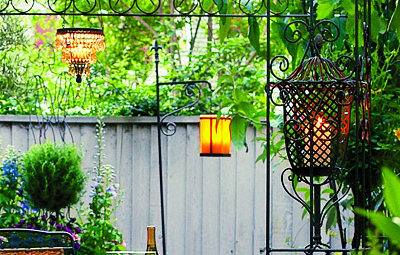 Layered lighting for an outdoor dining space.