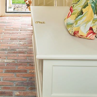 a flip-top bench in a mudroom