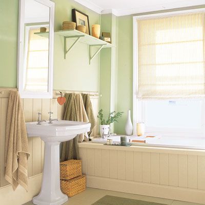 A bathroom with a paneled tub.