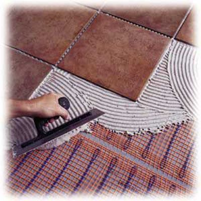 A tile bathroom floor with radiant heating underneath.