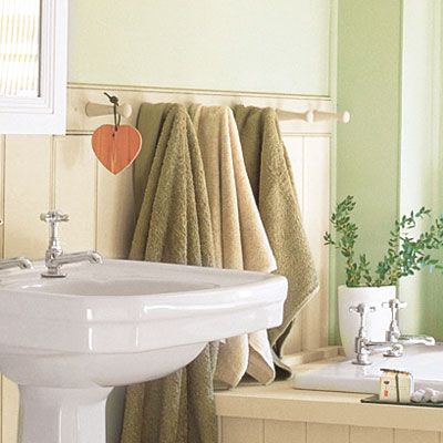 A bathroom with a peg-rail towel rack.