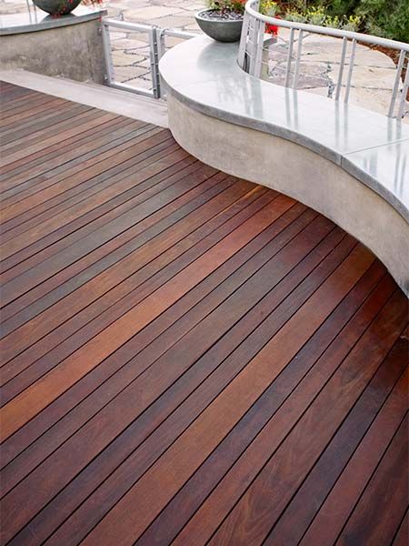 A hardwood deck with mixed color boards.