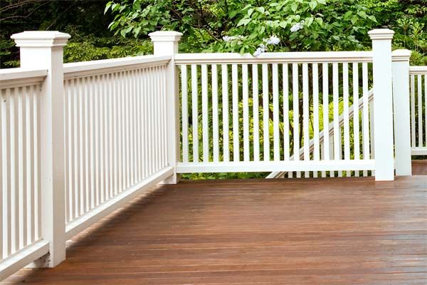 A hardwood deck with composite railing.