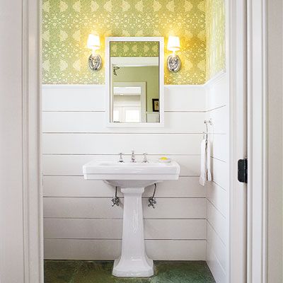 A bathroom with horizontal wainscoting.