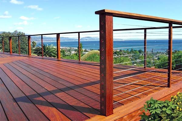 A hardwood deck with cable railing.