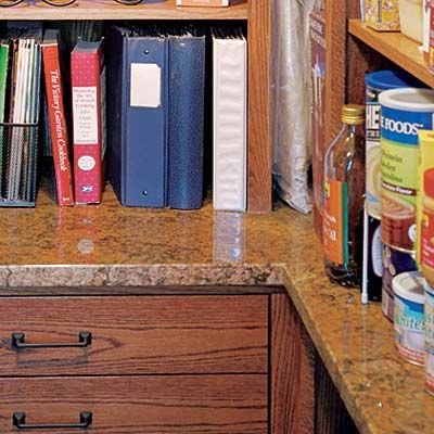 a granite counter within a pantry