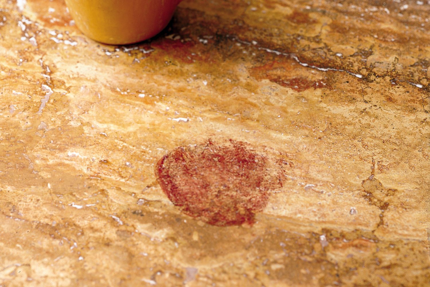 a dark, noticeable stain on a kitchen countertop