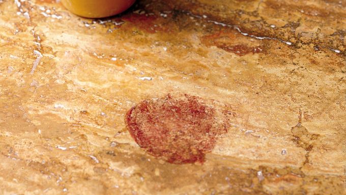 a dark, noticeable stain on a kitchen countertop