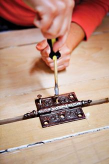 Attaching a hinge to the shutter