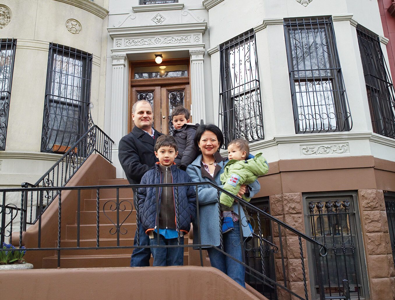 The Shen-Costello family in front of their 1904 Renaissance Revival brownstone.