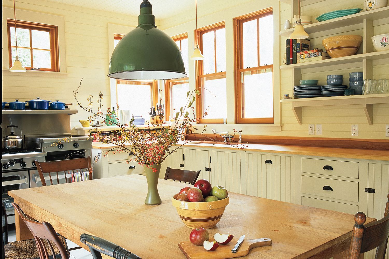 a unique pendant light hanging over a kitchen table