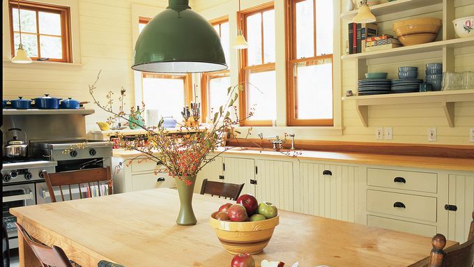 a unique pendant light hanging over a kitchen table