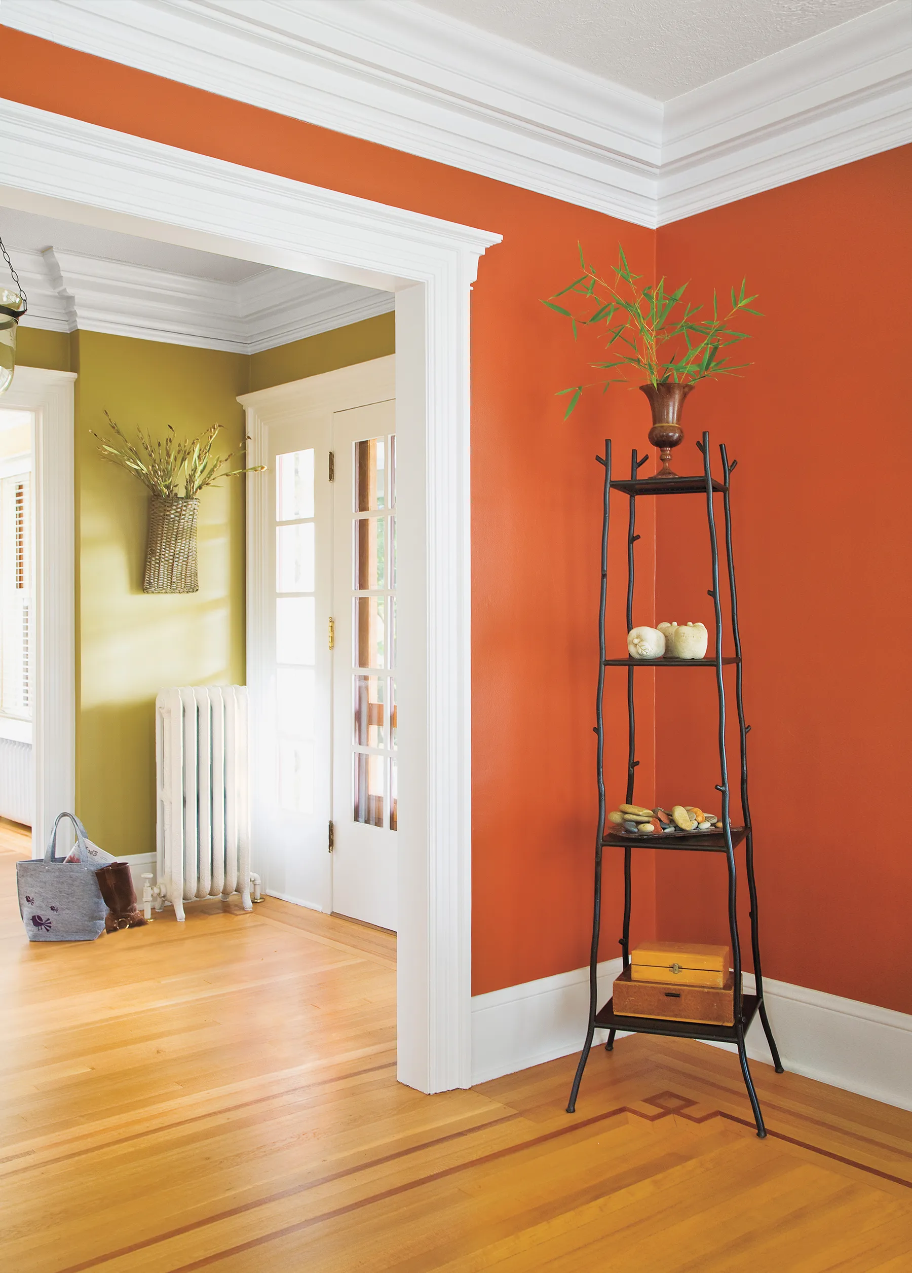 an entryway to a room with crown molding along the wall.