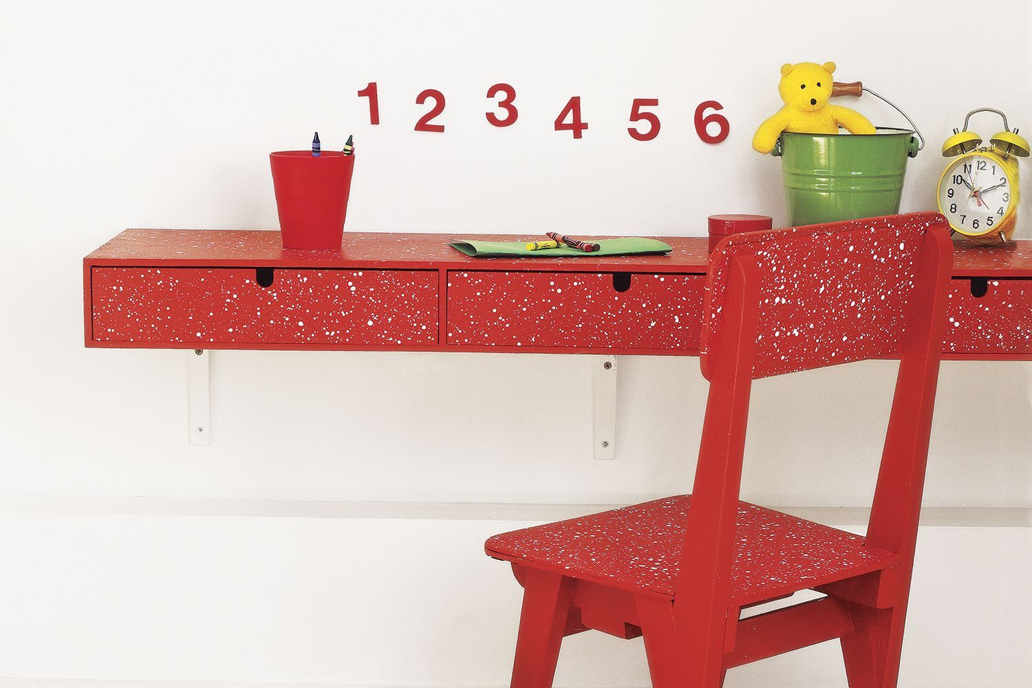 A room with pieces of paint spattered furniture