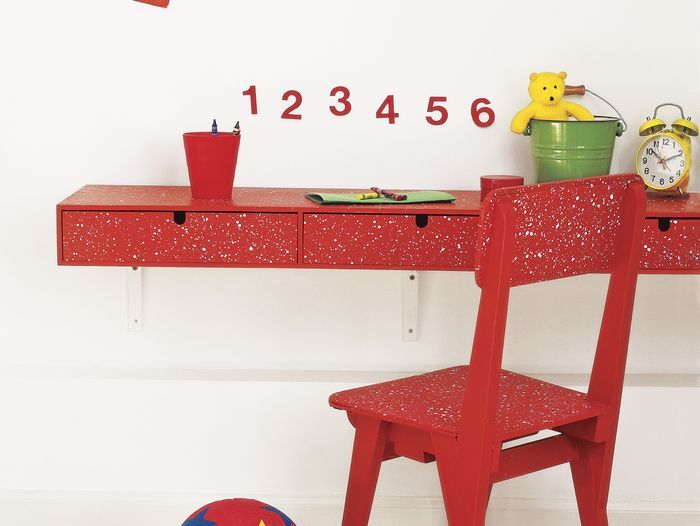 A room with pieces of paint spattered furniture