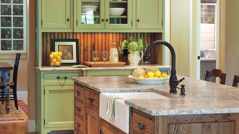 A kitchen island in the center of a kitchen.